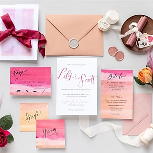 Discover the artistry of Simply Enchanted Events through their impeccable wedding stationery collection. The image showcases a stunning array of wedding invites, beautifully designed flyers, and delicate envelopes, each reflecting the unique style and theme of the couple's special day. The attention to detail is evident, from the intricate patterns and elegant fonts to the luxurious paper quality. Completing the enchanting ensemble are personalized napkins, showcasing the bride and groom's initials. Simply Enchanted Events ensures that every aspect of the wedding experience is adorned with elegance and charm, creating unforgettable memories for all.