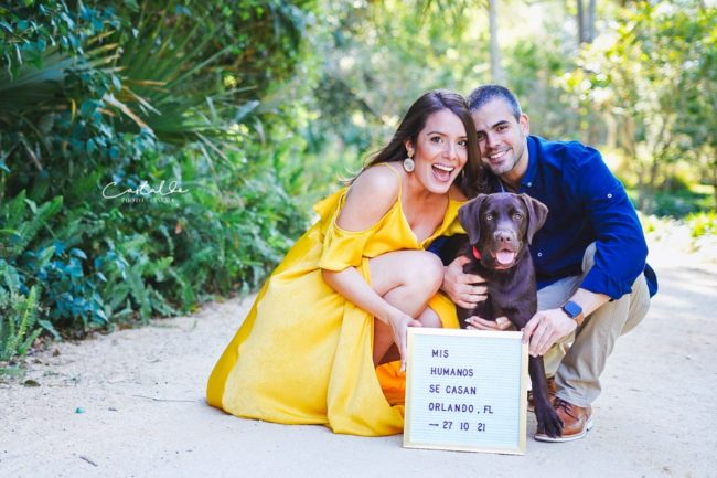 In this delightful photograph taken by Castaldo Studio in Orlando, FL, a couple shares a heartwarming moment with their furry friend. With smiles on their faces, they pose together, radiating love and happiness. Their beloved dog joins in the frame, adding an extra touch of charm and playfulness to the scene. Castaldo Studio expertly captures the love and bond between this couple and their canine companion, creating a treasured memory that will be cherished for years to come.