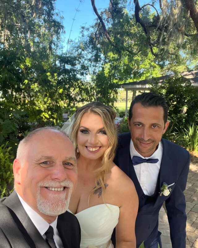 Radiant selfie captured in the enchanting garden of Garden Villa, featuring Ceremonies By Ray, the beautiful bride, and the dashing groom. A magical moment during their wedding celebration at All Inclusive Weddings Orlando