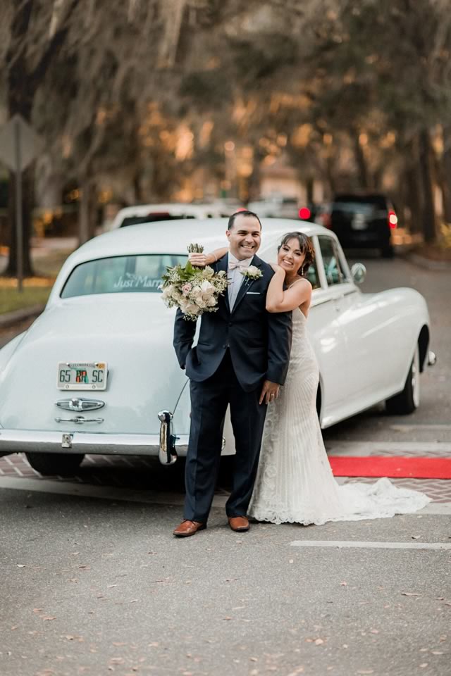 Intimate Moment: Couple Embracing in front of 1957 Rolls-Royce Silver Cloud Diana