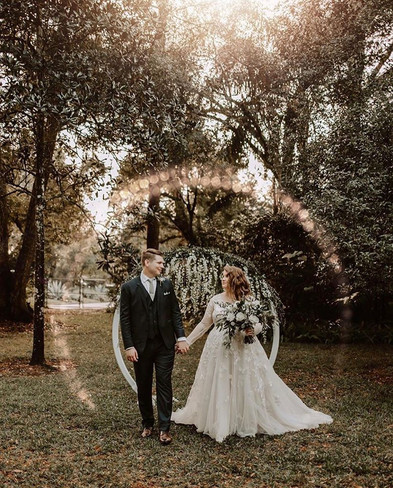 Enchanted Garden Villa: Bride and Groom Holding Hands in the Circle of Love