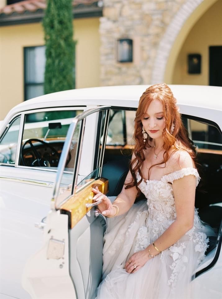 Stunning Bride Exiting VIP Wedding Transportation