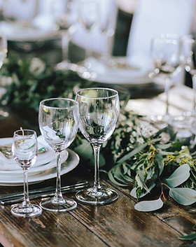 Elegant Wedding Table Setting with Classic Crystal Glasses and White Plates