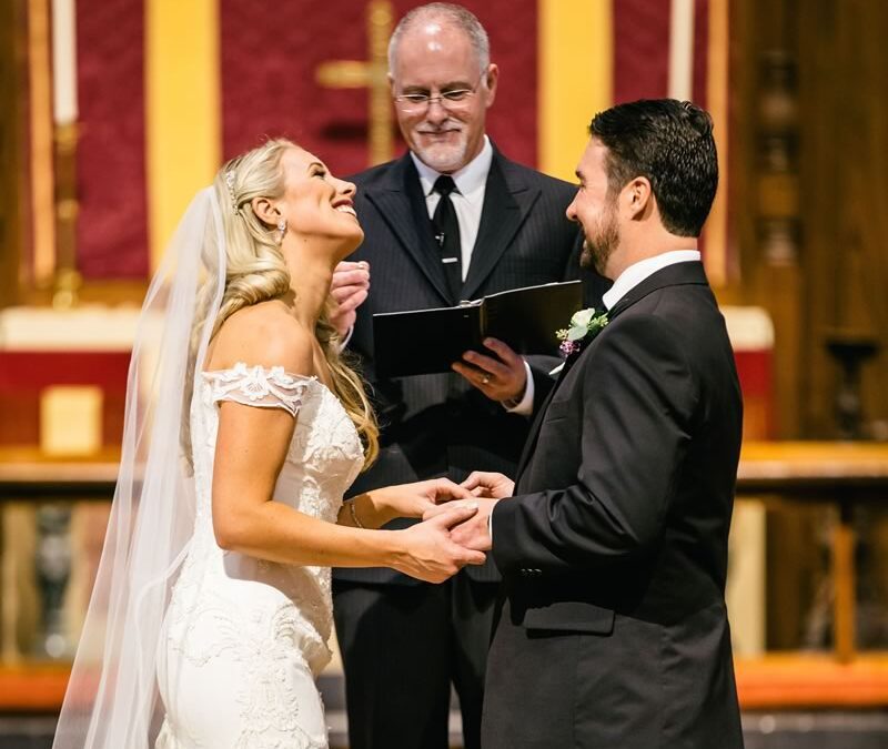 Ceremonies By Ray at All Inclusive Weddings Orlando, capturing the beautiful bond between the bride and groom as they share smiles and laughter during their wedding ceremony, creating cherished memories