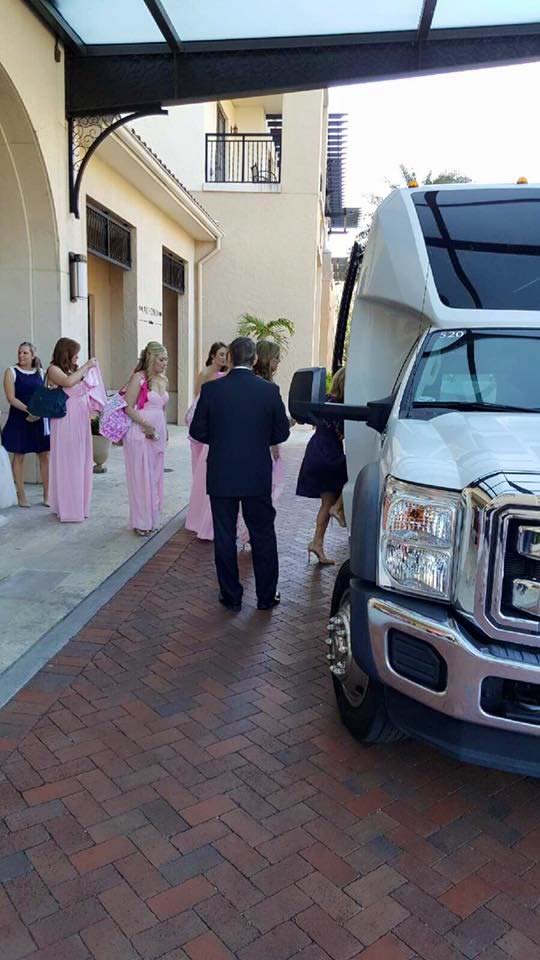 Bridesmaids boarding the White Luxury Mini Bus for VIP Wedding Transportation