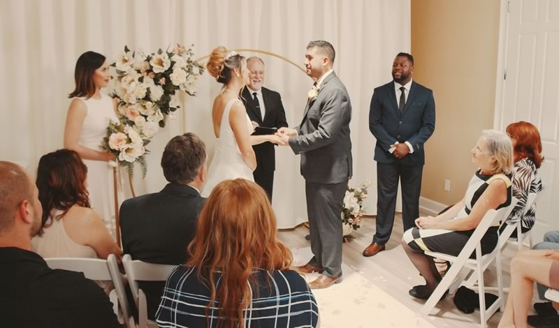 Captivating indoor wedding reception captured at All Inclusive Weddings Orlando, featuring Ceremonies By Ray. The bride, groom, and their guests gather to celebrate and create beautiful memories in a stylishly decorated venue