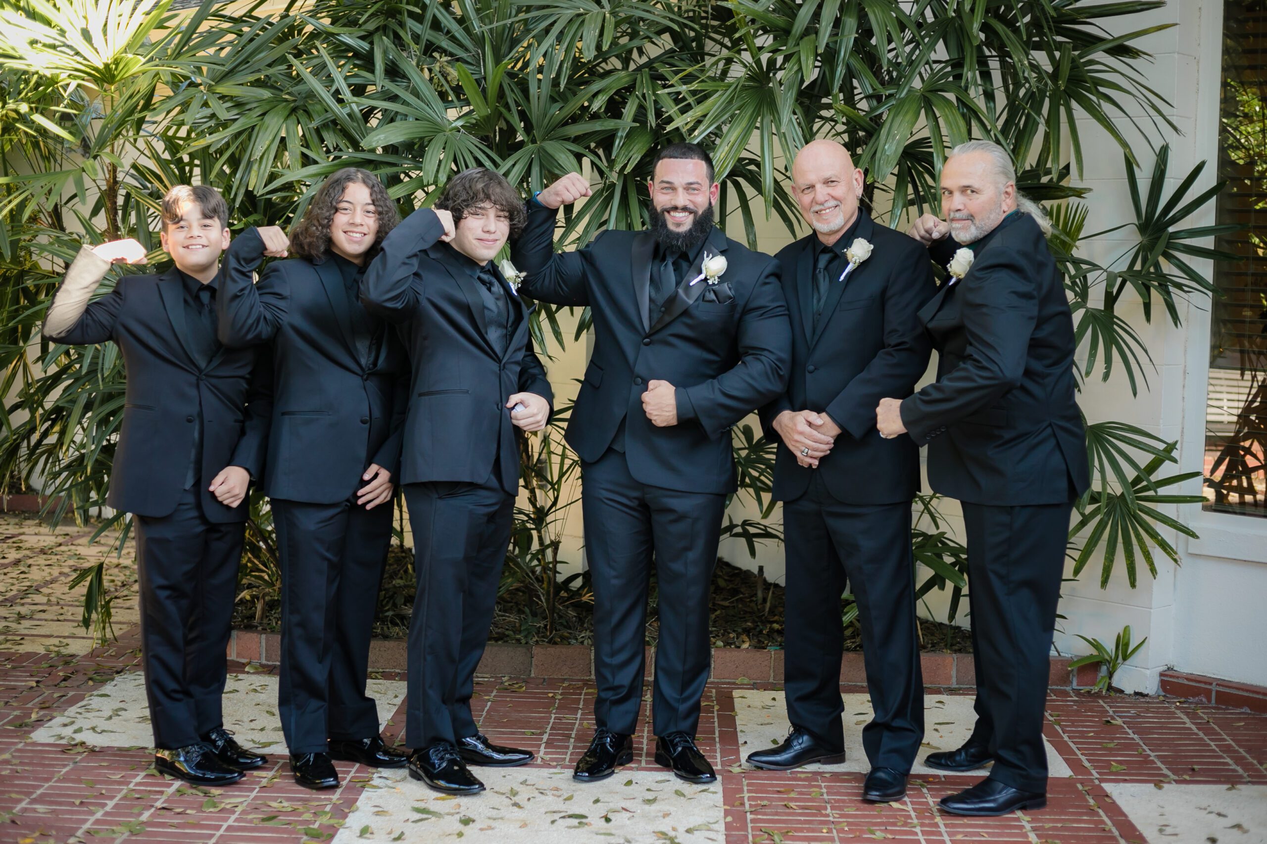 Groom And Crew Flexing For Great Picture At All Inclusive Weddings Orlando