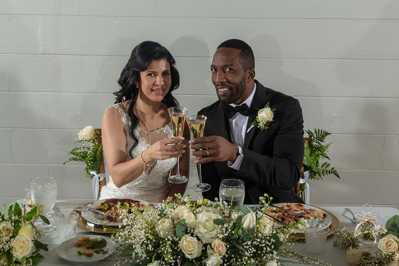 Happy Newly Weds Champaign Toast At All Inclusive Weddings Orlando After Dinner At Table With Gorgeous Decorations