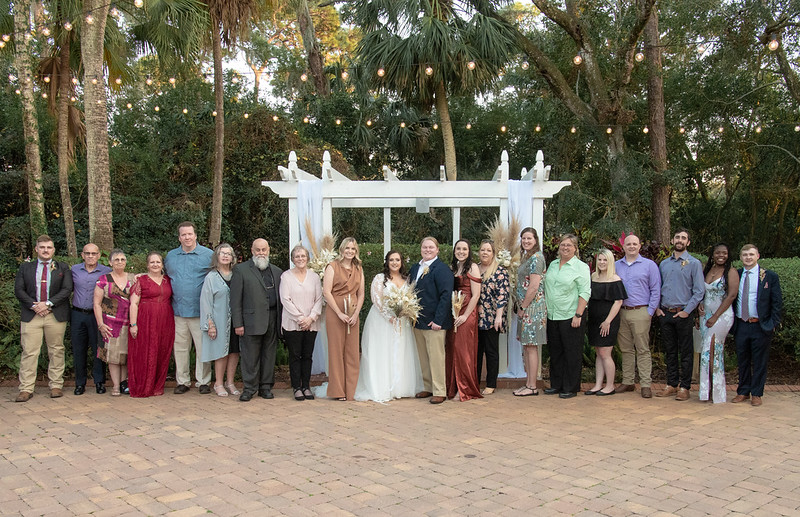 Big family photo at All Inclusive Weddings Orlando: A joyful group of family members gathered together, celebrating after the wedding