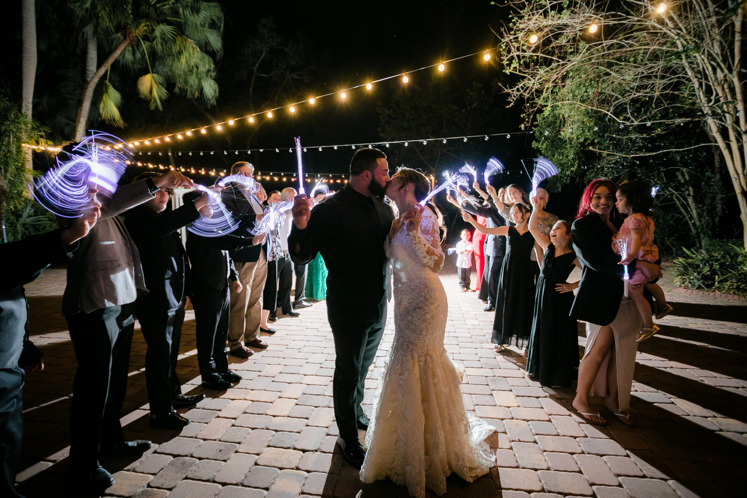 Bride and Groom Kissing During Sparkler send-off at All Inclusive Weddings Orlando