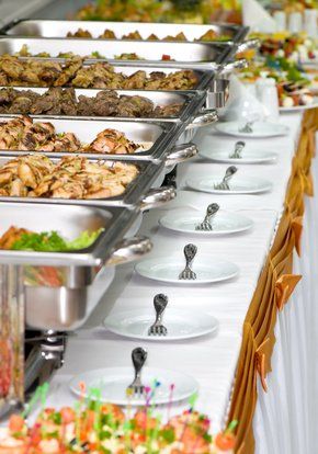 A delicious wedding buffet spread featuring a variety of mouthwatering dishes, including succulent chicken, flavorful beef, and an assortment of delectable sides at All Inclusive Weddings Orlando