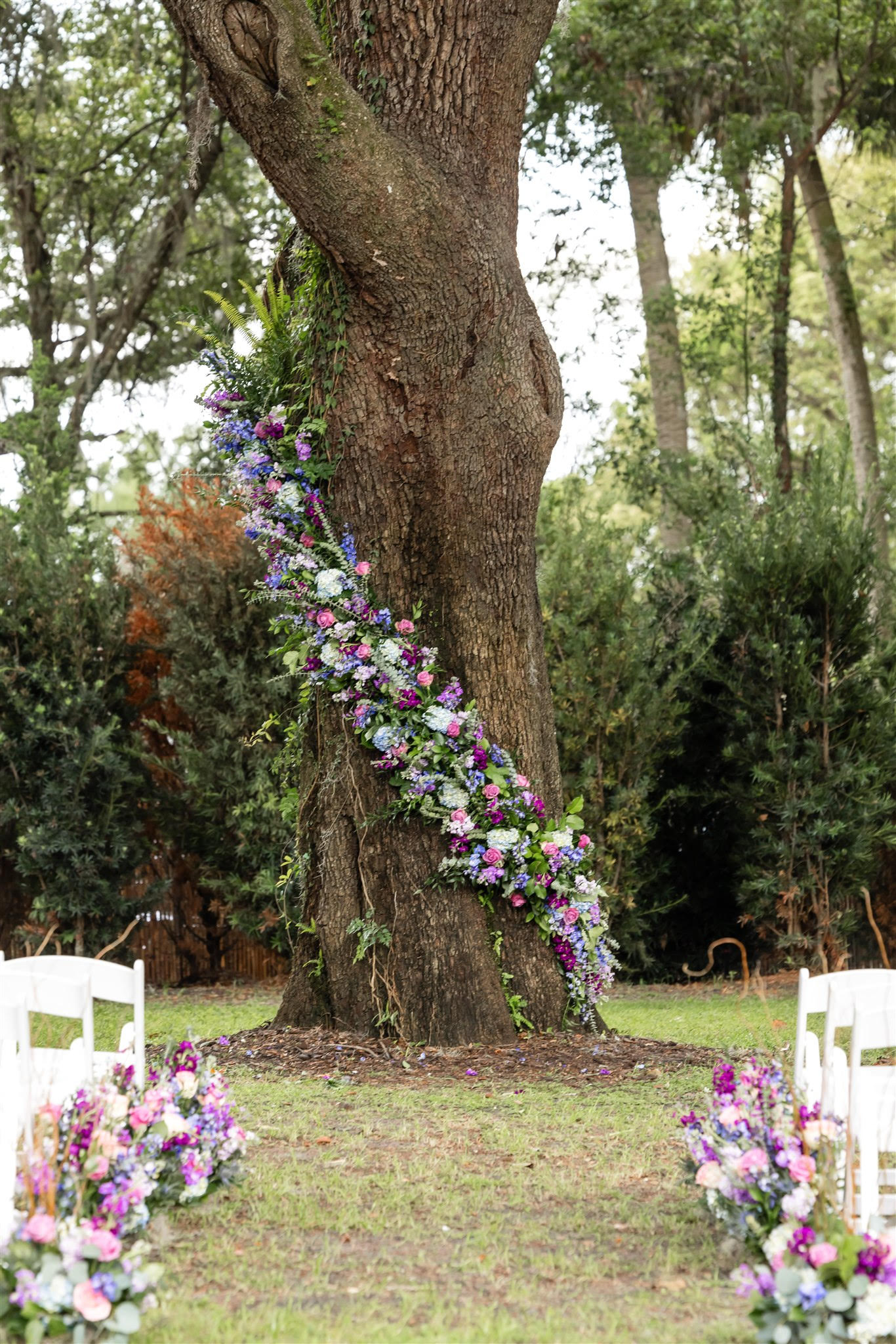 Elegant tree adorned with flowers for the ceremony setup at Simply Enchanted, Orlando, FL