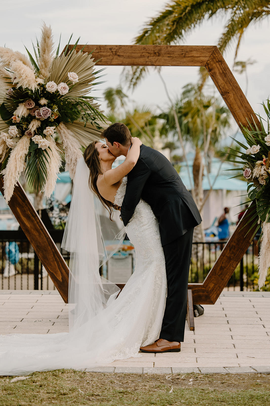 Elegant outdoor ceremony adorned with floral arch at Simply Enchanted Events.