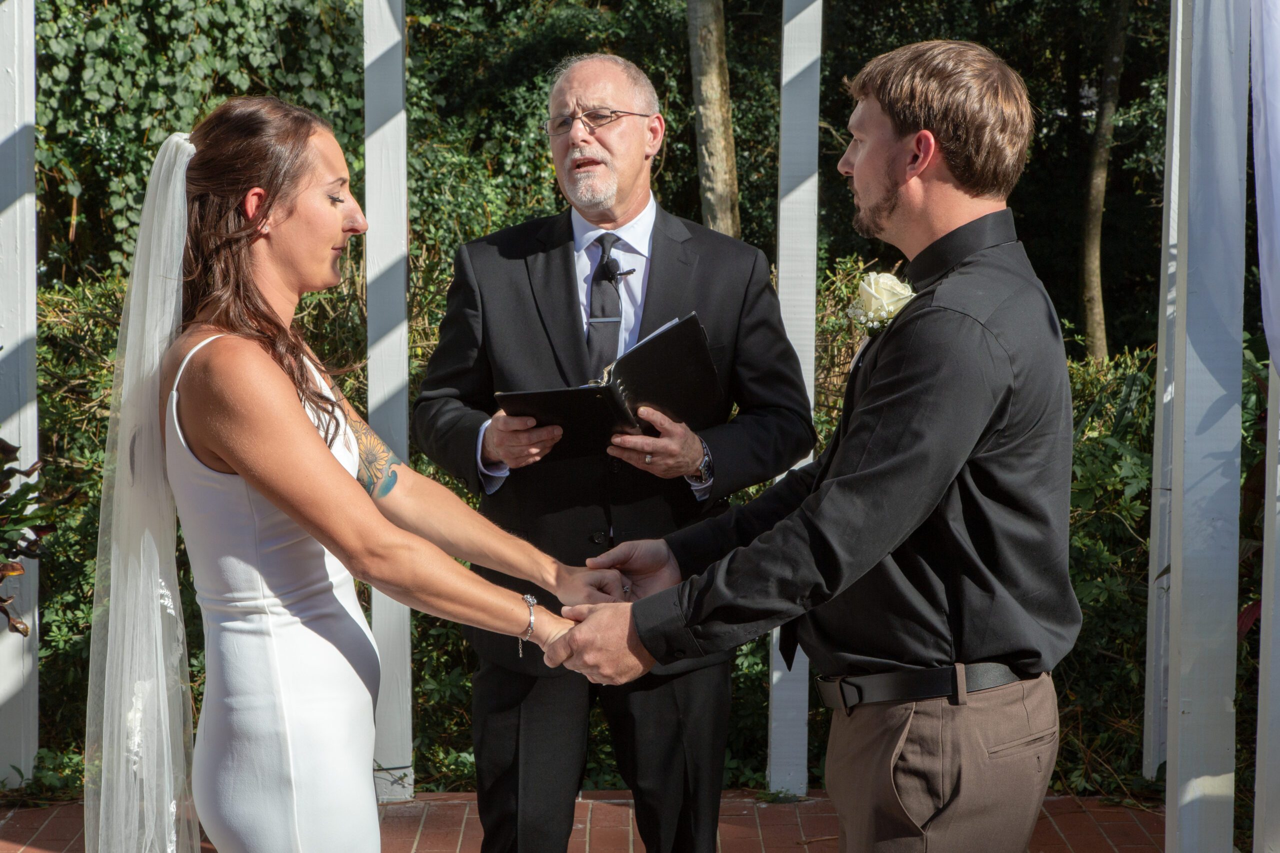 All Inclusive Weddings Orlando - Officiant Ray Uniting Hearts at the Altar