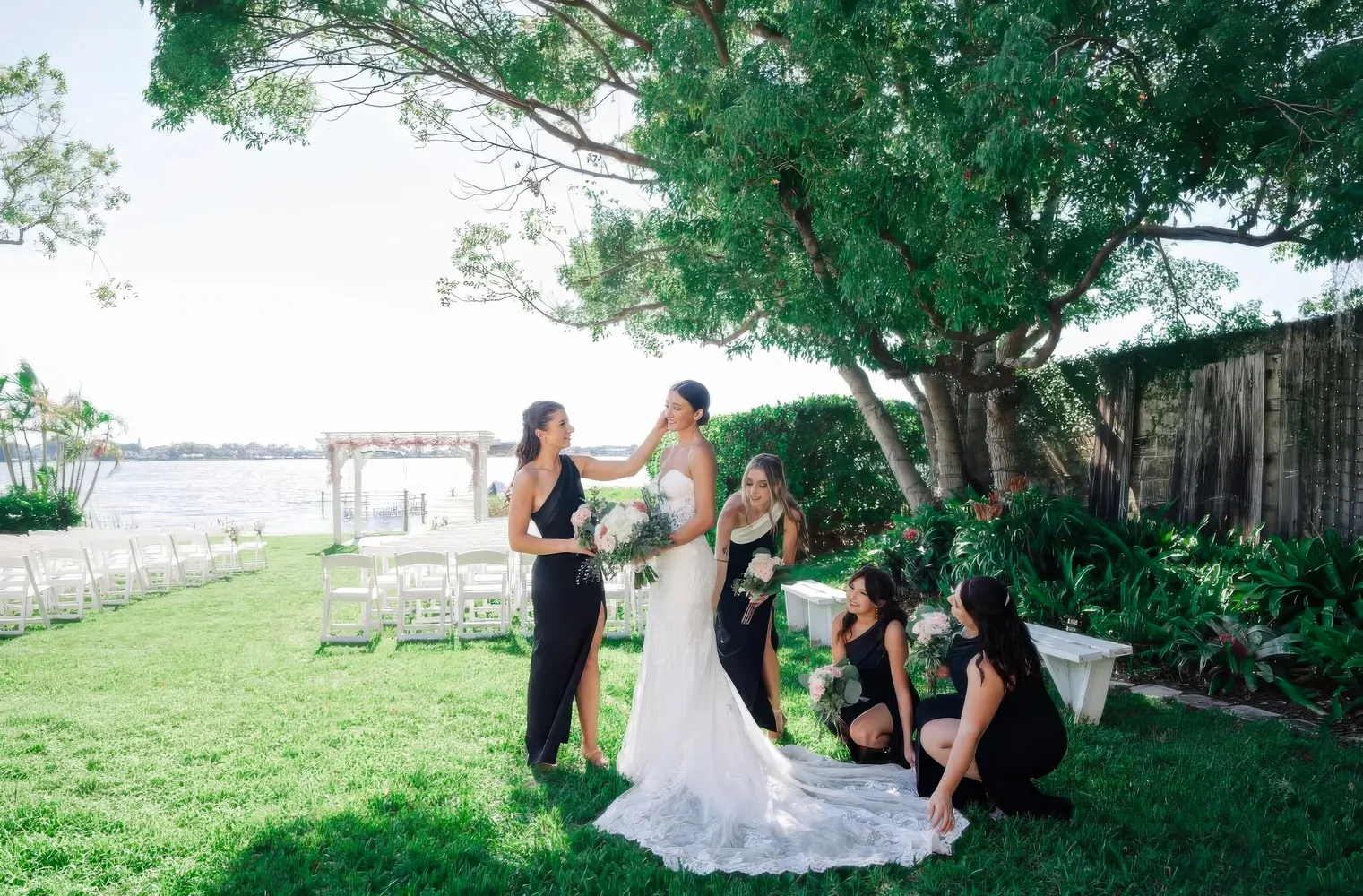 Experience the enchantment of The Garden Villa at All Inclusive Weddings Orlando. A picturesque view of the outdoor garden ceremony setup with beautifully arranged chairs and an elegant altar awaits you